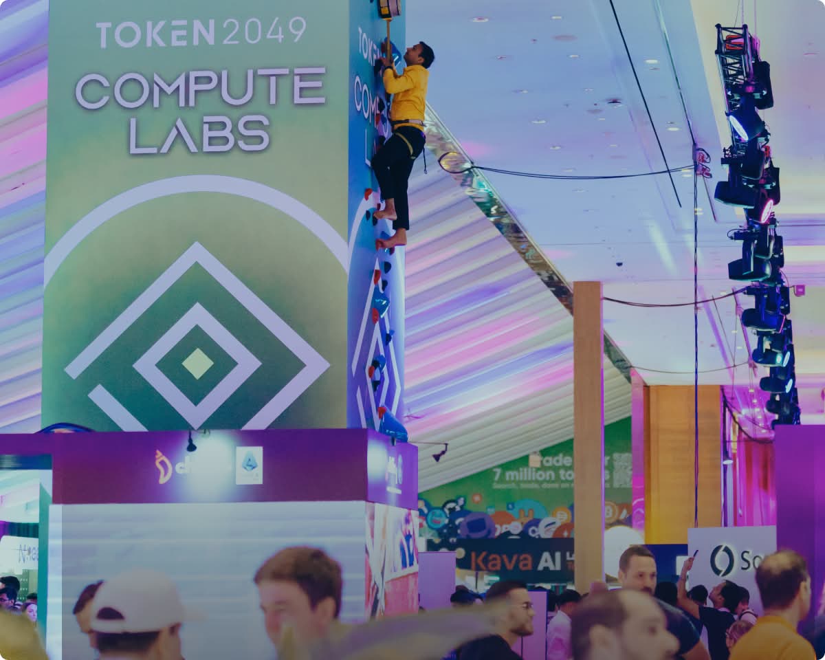 TOKEN2049 Compute Labs booth with colorful displays in Singapore tech conference