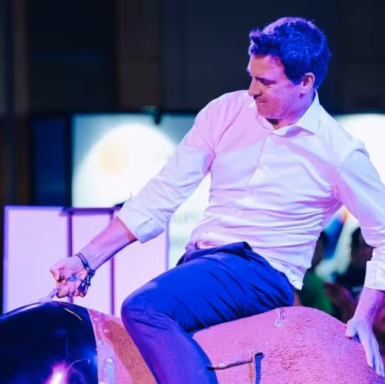 Speaker gesturing dynamically at TOKEN2049 conference in Singapore