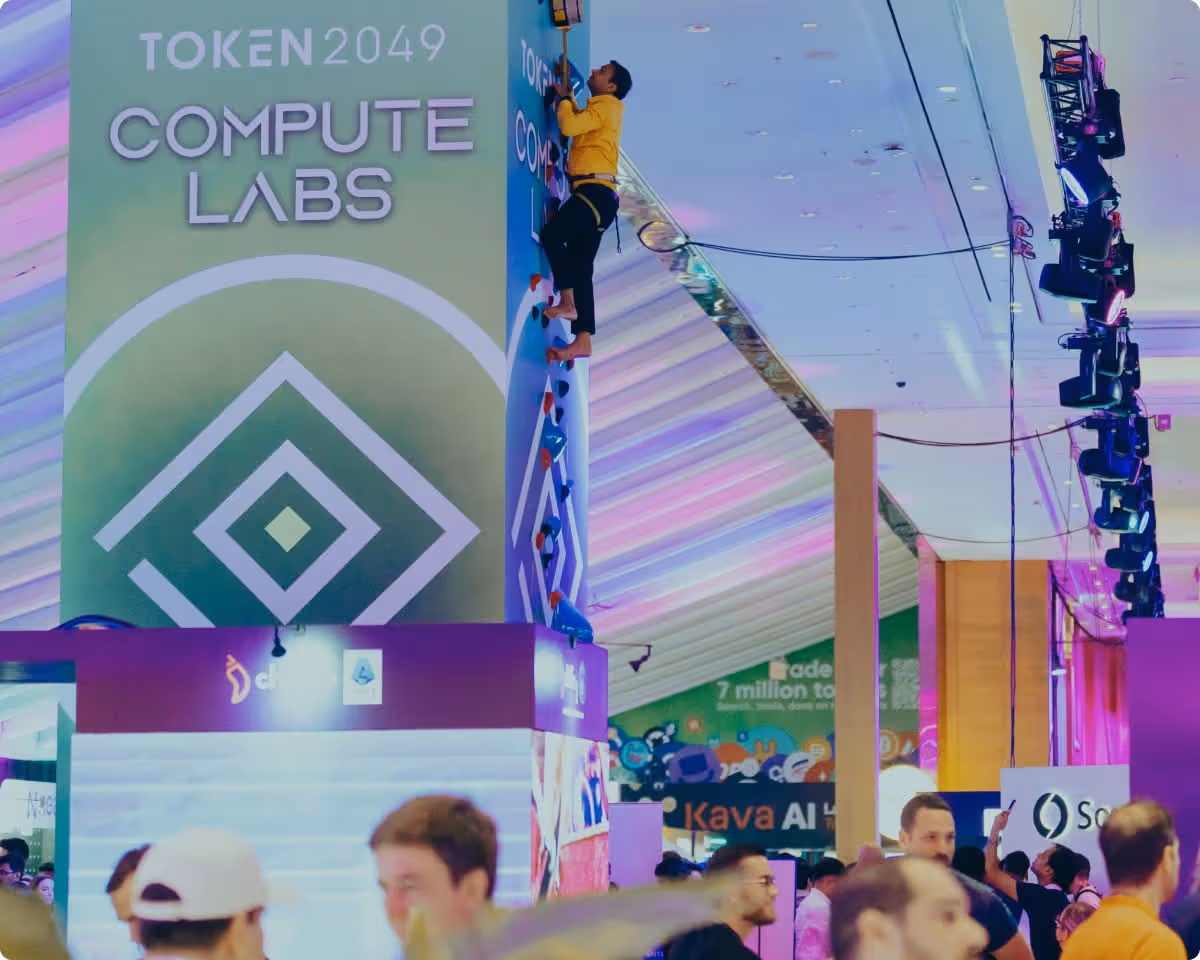 TOKEN2049 Compute Labs booth with colorful displays in Singapore tech conference